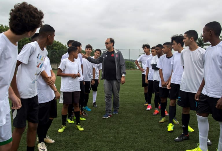 Scout Jorge Athayde selects players during a trial in which they play under the watch of scouts from one of Brazil's biggest football clubs, Vasco da Gama, in northern Rio de Janeiro