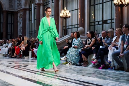 A model presents a creation during the Victoria Beckham catwalk show at London Fashion Week in London