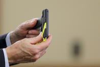 Prosecutor William McCauley holds up a gun previously entered as evidence in the murder trial of former New England Patriots football player Aaron Hernandez at Bristol County Superior Court in Fall River, Massachusetts April 1, 2015. A former friend of Hernandez testified on Wednesday that he saw the ex-New England Patriots player handle a gun similar to the one prosecutors contend he used to murder an acquaintance, and that Hernandez had a distrustful nature. Alexander Bradley, who had been friends with the former tight end, was permitted to tell jurors that Hernandez had access to the type of pistol he is accused of using to murder semipro football player Odin Lloyd, but not about a separate 2013 incident in which Bradley contends Hernandez shot him in the face. Hernandez, 25, is charged with killing Lloyd, who was dating his fiancee’s sister. Lloyd was found shot dead in June 2013 in an industrial park near Hernandez's home in North Attleborough, Massachusetts. REUTERS/Brian Snyder