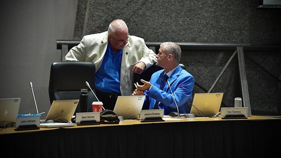 Kanata South Coun. Allan Hubley Beacon speaks with Hill-Cyrville Coun. Tim Tierney during a debate on developer donations to wards on July 10, 2024.