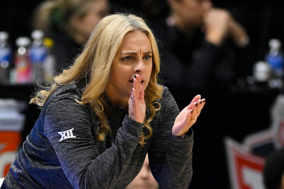 Baylor head coach Nicki Collen cheers her team on against Oklahoma during the first half of an NCAA college basketball game in the Big 12 Conference tournament in Kansas City, Kan., Friday, March 11, 2022. (AP Photo/Reed Hoffmann)