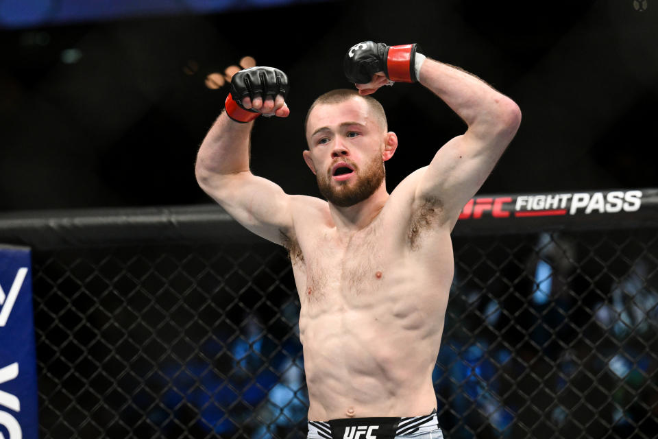 Mar 18, 2023; London, UNITED KINGDOM; Jake Hadley (red gloves) fights Malcolm Gordon (not pictured) during UFC 286 at O2 Arena. Mandatory Credit: Per Haljestam-USA TODAY Sports