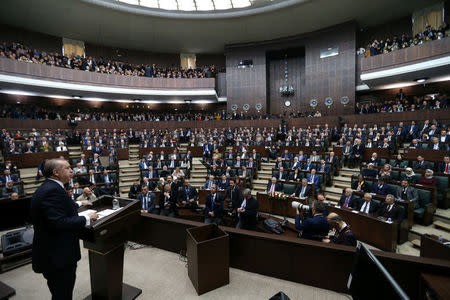 Turkish President Tayyip Erdogan addresses members of parliament from his ruling AK Party (AKP) during a meeting at the Turkish parliament in Ankara, Turkey, February 20, 2018. Murat Cetinmuhurdar/Presidential Palace/Handout via REUTERS