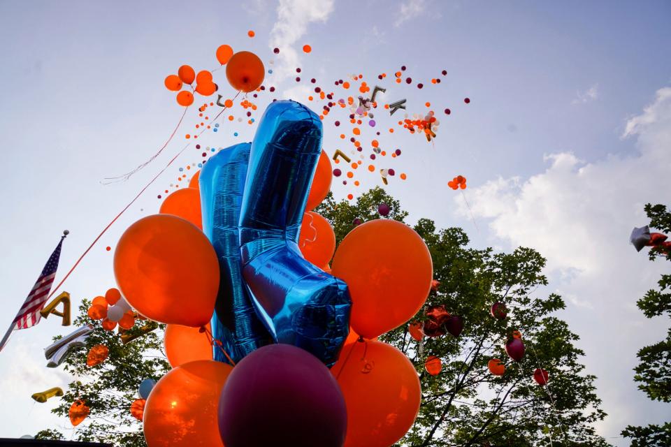 Community members release balloons during a vigil honoring Khalil Amari Allen, 18, in Southfield on Friday, July 14, 2023. Allen was shot and killed while driving to get food the evening of July 11.