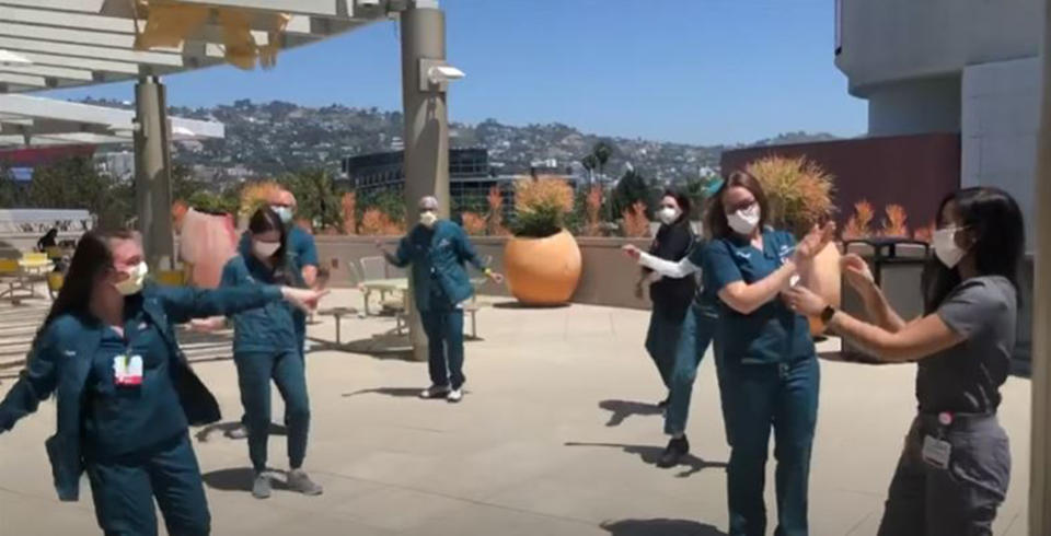 Healthcare workers danced in the video wearing uniforms and masks. (Ariana Grande/ Youtube)