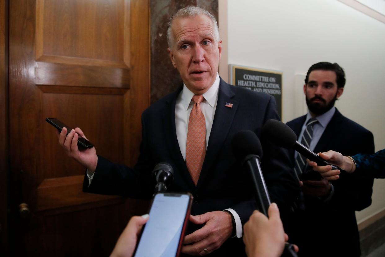 In this 12 March 2020 file photo, Senator Thom Tillis pauses to speak to media on Capitol Hill in Washington: AP