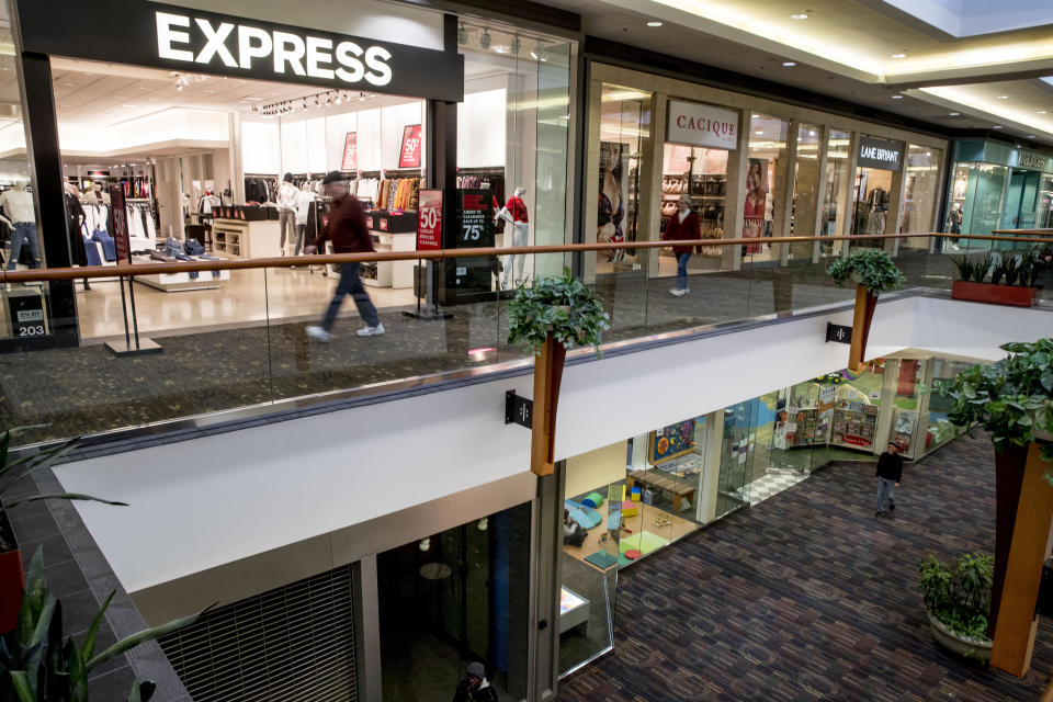 FILE - In this Jan. 22, 2020, file photo a store front is closed below an Express retail clothing store in Valley West Mall in West Des Moines, Iowa. On Tuesday, Jan. 28, the Conference Board reports on U.S. consumer confidence for January. (AP Photo/Andrew Harnik, File)