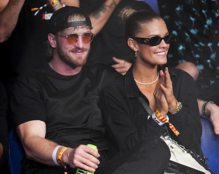 Logan Paul, left, and Nina Agdal are at UFC 284 at RAC Arena in Perth, Australia.