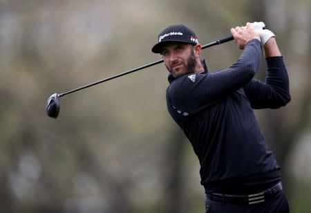 May 14, 2019; Farmingdale, NY, USA; Dustin Johnson plays his shot from the 12th tee during a practice round for the PGA Championship golf tournament at Bethpage State Park - Black Course. Mandatory Credit: Peter Casey-USA TODAY Sports