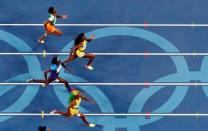 2016 Rio Olympics - Athletics - Final - Women's 100m Final - Olympic Stadium - Rio de Janeiro, Brazil - 13/08/2016. Gold medalist Elaine Thompson (JAM) of Jamaica (top R) competes. REUTERS/Fabrizio Bensch