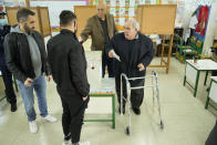 An elderly man casts his vote during the presidential elections in Geroskipou in south west coastal city of Paphos, Cyprus, Sunday, Feb. 5, 2023. Cypriots began voting for their eighth new president in the ethnically divided island’s 62-year history as an independent republic, with three front-runners each portraying themselves as the safest bet to guide the country through turbulent economic times and to seek peace with breakaway Turkish Cypriots. (AP Photo/Petros Karadjias)