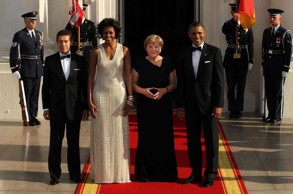 To host German Chancellor Angela Merkel and her husband Joachim Sauer for a state dinner in June 2011, Michelle Obama sparkled in a dress completely embellished with gems and stones. (Photo: Getty Images)