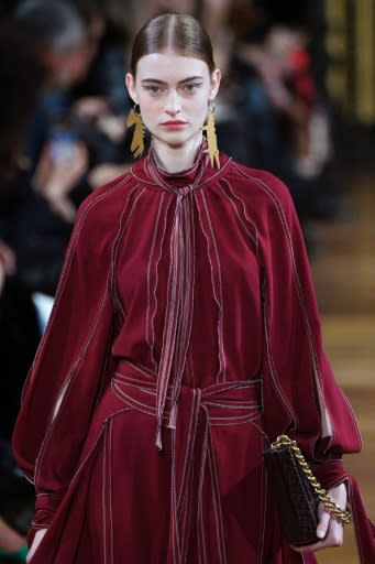 A model with crocodile earrings at the Stella McCartney Paris fashion week show