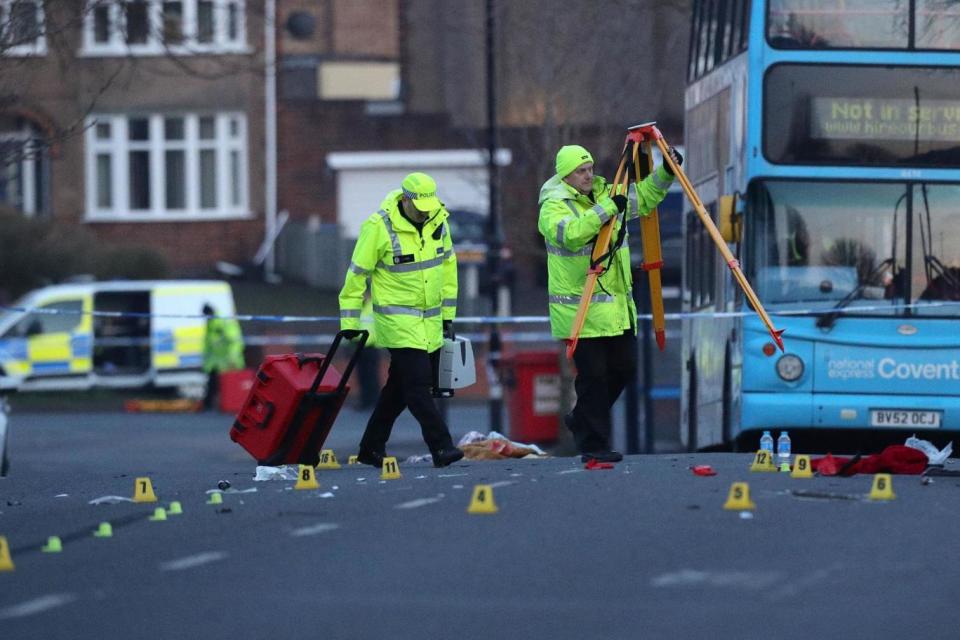 Police carry out an investigation at the scene (PA)