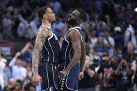 Dallas Mavericks forwards P.J. Washington, left, and Tim Hardaway Jr. celebrate a play during the second half of the team's NBA basketball game against the Golden State Warriors in Dallas, Friday, April 5, 2024. (AP Photo/LM Otero)