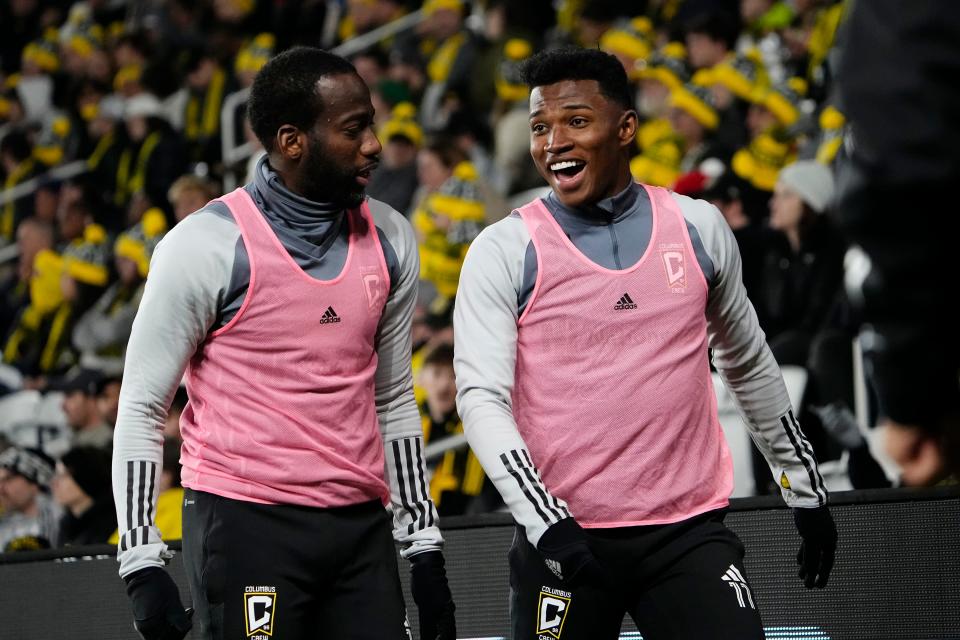 Mar 4, 2023; Columbus, Ohio, USA;  Columbus Crew midfielder Kevin Molino (13) and midfielder Luis Diaz (11) warm up during the second half of the MLS soccer match against D.C. United at Lower.com Field. Mandatory Credit: Adam Cairns-The Columbus Dispatch