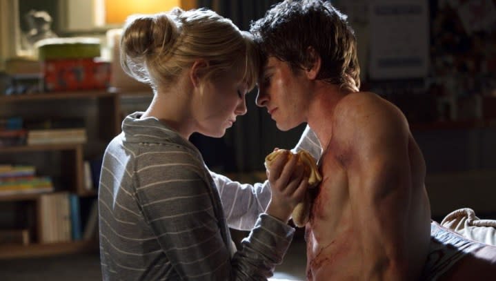 A woman tends to a man in The Amazing Spider-Man.