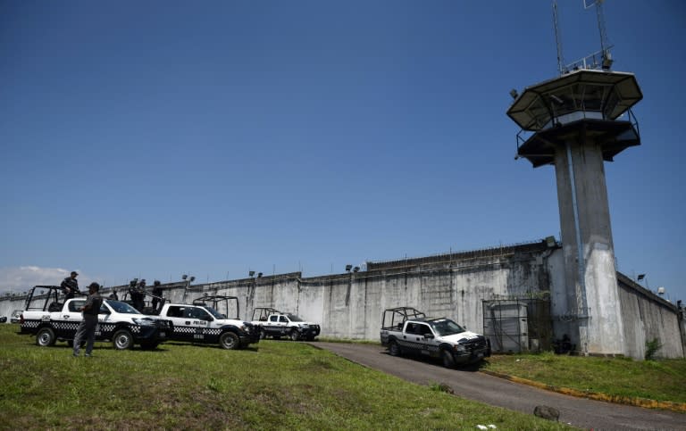 Policemen guard the entrance of "La Toma" prison where on Sunday at dawn a riot was registered inside with a balance of 7 policemen killed, in Amatlan de los Reyes, Veracruz State, Mexico