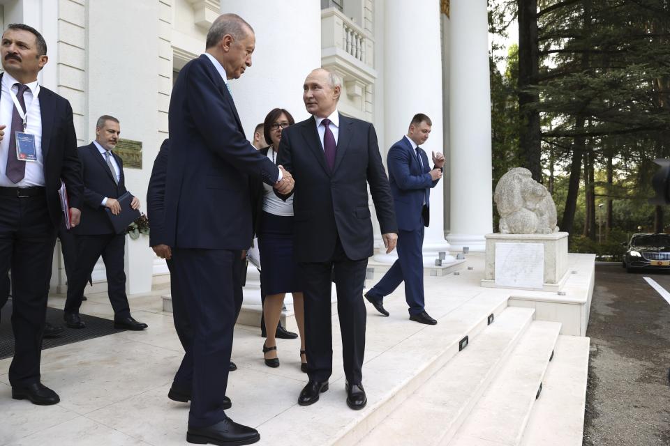 Turkish President Recep Tayyip Erdogan, center left, and Russian President Vladimir Putin, center right, shake hands after their talks at Russia's Black Sea resort of Sochi, Russia, Monday, Sept. 4, 2023. (Sergei Karpukhin, Sputnik, Kremlin Pool Photo via AP)