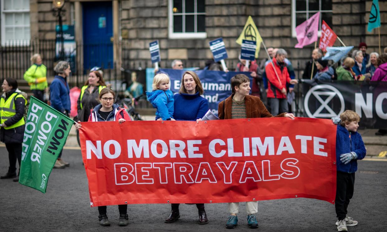 <span>Climate activists protesting outside Bute House last week after the government scrapped a target to cut emissions by 75% before 2030.</span><span>Photograph: Anadolu/Getty Images</span>