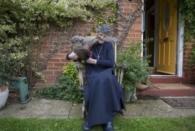 Sister Rachel Denton sits with her chicken in the garden of St Cuthbert's Hermitage in Lincolnshire, north east Britain August 24, 2015. REUTERS/Neil Hall