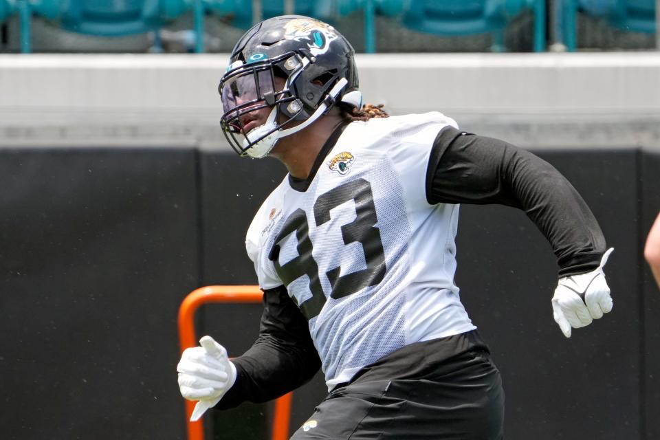 Jacksonville Jaguars defensive end Tyler Lacy (93) performs a drill during an NFL football rookie camp, Friday, May 12, 2023, in Jacksonville, Fla. (AP Photo/John Raoux)