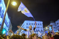 Argentina fans celebrate in Madrid downtown, Spain after the World Cup final soccer match between Argentina and France in Qatar, Sunday, Dec. 18, 2022. (AP Photo/Andrea Comas)