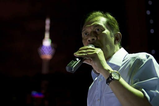 Malaysian opposition leader Anwar Ibrahim speaks at a rally on the eve of a verdict in a trial with sodomy charges in Kuala Lumpur. Malaysia braced Monday for a verdict in the politically charged sodomy trial of opposition leader Anwar, whose supporters have vowed to bring thousands onto the streets of the capital