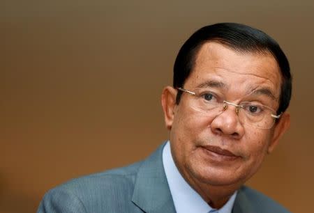 FILE PHOTO: Cambodia's Prime Minister Hun Sen attends a plenary session at the National Assembly of Cambodia in central Phnom Penh, October 16, 2017. REUTERS/Samrang Pring