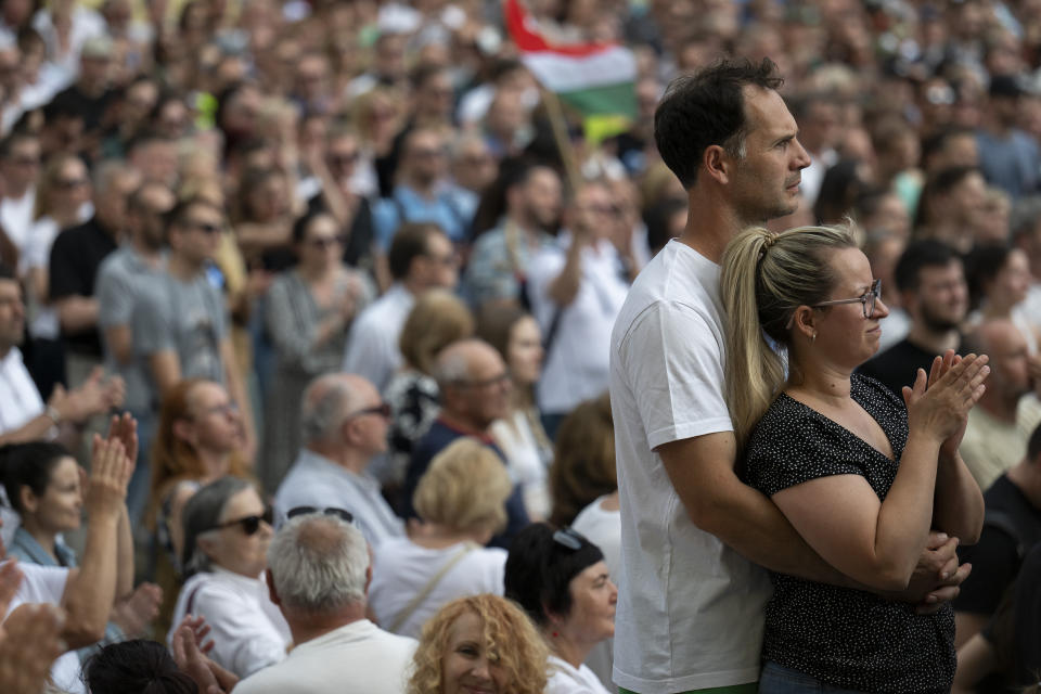 People listen to Péter Magyar's speech at a campaign rally in the rural city of Debrecen, Hungary, on Sunday, May 5, 2024. Magyar, whose TISZA party is running in European Union elections, has managed to mobilize large crowds of supporters on a campaign tour of Hungary's heartland, a rarity for an Orbán opponent. (AP Photo/Denes Erdos)