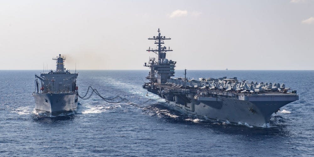 The aircraft carrier USS Theodore Roosevelt (CVN 71) receives fuel from the fleet replenishment oiler USNS Tippecanoe (T-AO 199) during a replenishment at sea March 17, 2020