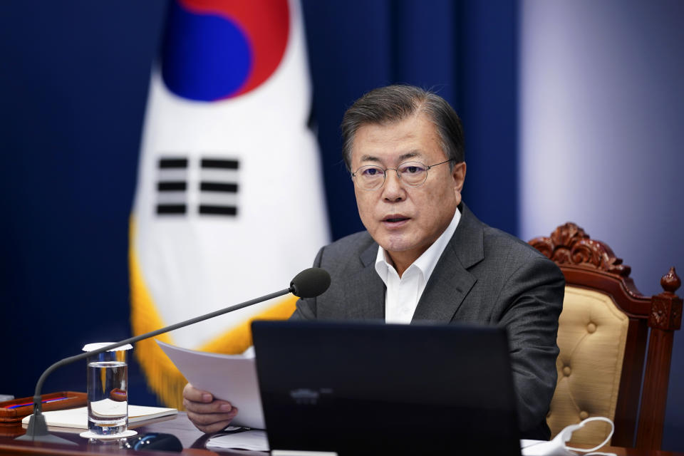 South Korean President Moon Jae-in speaks during a meeting of his senior secretaries at the presidential Blue House in Seoul, South Korea, Monday, April 12, 2021. Moon on Monday welcomed a decision by two South Korean electric vehicle battery makers to settle a long-running intellectual property dispute that had threatened thousands of American jobs and President Joe Biden's environmental policies. (Choe Jae-koo/Yonhap via AP)