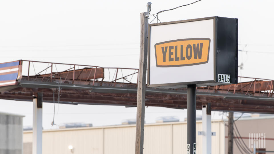 A Yellow sign at a terminal