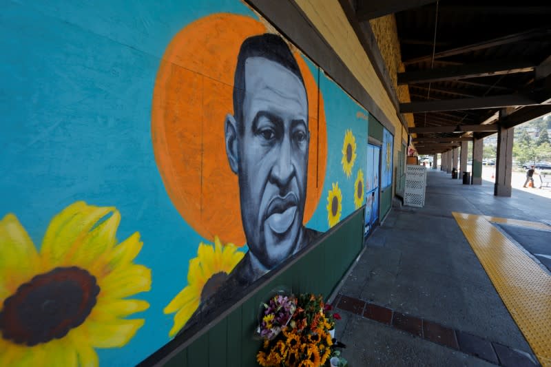 FILE PHOTO: Residents help clean up their small California town after riots and looting