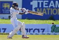 Sri Lankan batsman Pathum Nissanka plays a shot against West Indies during the fourth day of their second test cricket match in Galle, Sri Lanka, Thursday, Dec. 2, 2021. (AP Photo/Eranga Jayawardena)