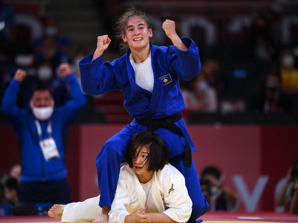 Kosovo's Nora Gjakova stands over Japan's Tsukasa Yoshida in the judo women's -57kg semifinal