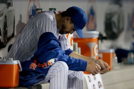 FILE PHOTO - Apr 9, 2019; New York City, NY, USA; New York Mets starting pitcher Jacob deGrom (48) reacts in the dugout during the fourth inning against the Minnesota Twins at Citi Field. Mandatory Credit: Brad Penner-USA TODAY Sports