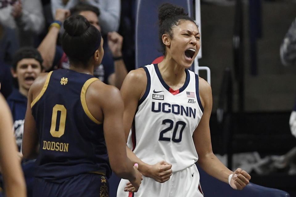 Connecticut's Olivia Nelson-Ododa (20) reacts after making a basket while fouled in the first half of an NCAA college basketball game against Notre Dame, Sunday, Dec. 5, 2021, in Storrs, Conn. (AP Photo/Jessica Hill)