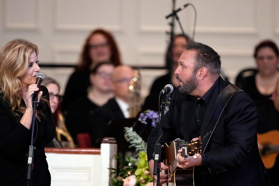 Garth Brooks and Trisha Yearwood perform "Imagine" during a tribute service for former first lady Rosalynn Carter at Glenn Memorial Church at Emory University on Tuesday, Nov. 28, 2023, in Atlanta. (AP Photo/Brynn Anderson, Pool)