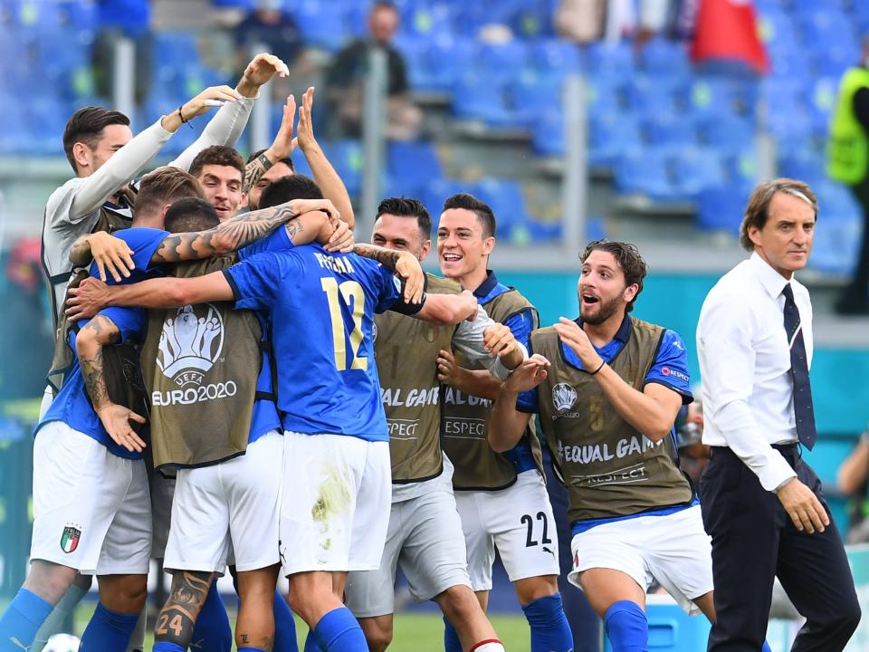 Roberto Mancini looks on as Matteo Pessina celebrates after scoring (Getty)
