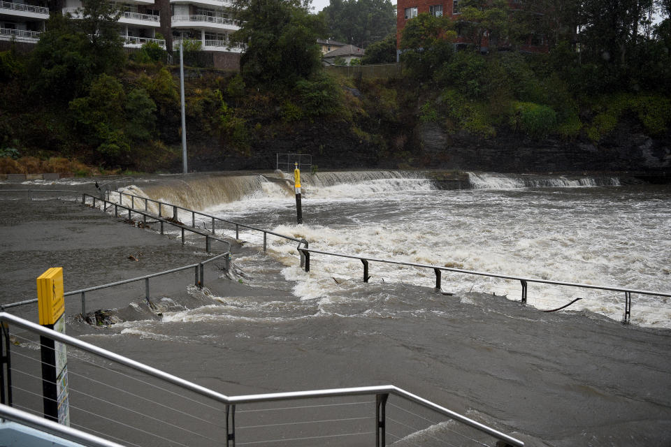 Water overflows the banks of the Parramatta River after heavy rains in Sydney.