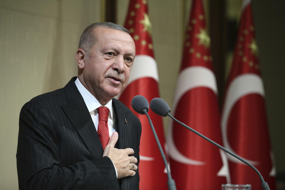 Turkish President Recep Tayyip Erdogan speaks during a reception on Republic Day, in Ankara, Turkey, Tuesday, Oct. 29, 2019. Erdogan said Russia has informed Turkey that Syrian Kurdish fighters have &quot; completely been removed &quot; from the areas in northeast Syria. (Presidential Press Service via AP, Pool)
