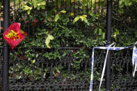 Flowers are seen next to police tape along Chambers street a day after a man driving a rented pickup truck mowed down pedestrians and cyclists on a bike path alongside the Hudson River in New York City, in New York, U.S. November 1, 2017. REUTERS/Shannon Stapleton