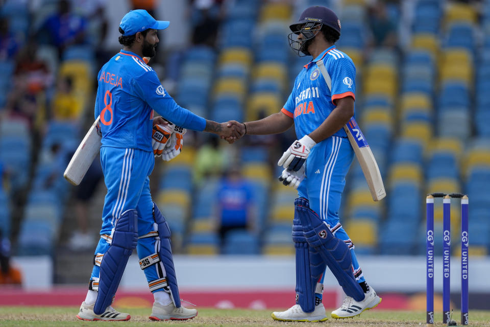 India's captain Rohit Sharma, right, and Ravindra Jadeja shake hands after defeating West Indies for five wickets in their first ODI cricket match at Kensington Oval in Bridgetown, Barbados, Thursday, July 27, 2023. (AP Photo/Ricardo Mazalan)