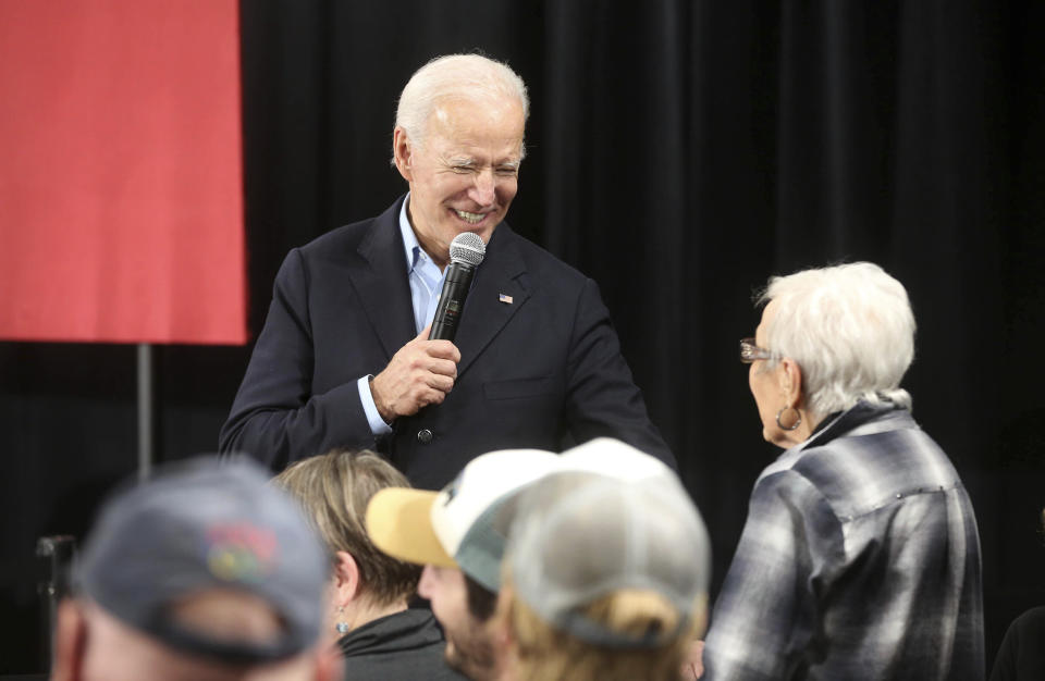 Democratic presidential candidate and former Vice President Joe Biden speaks with Marjorie Costigan, of Elkader, Iowa, during his "No Malarkey" bus tour at Johnson's Reception Hall in Elkader, Iowa, on Friday, Dec. 6, 2019. (Jessica Reilly/Telegraph Herald via AP)