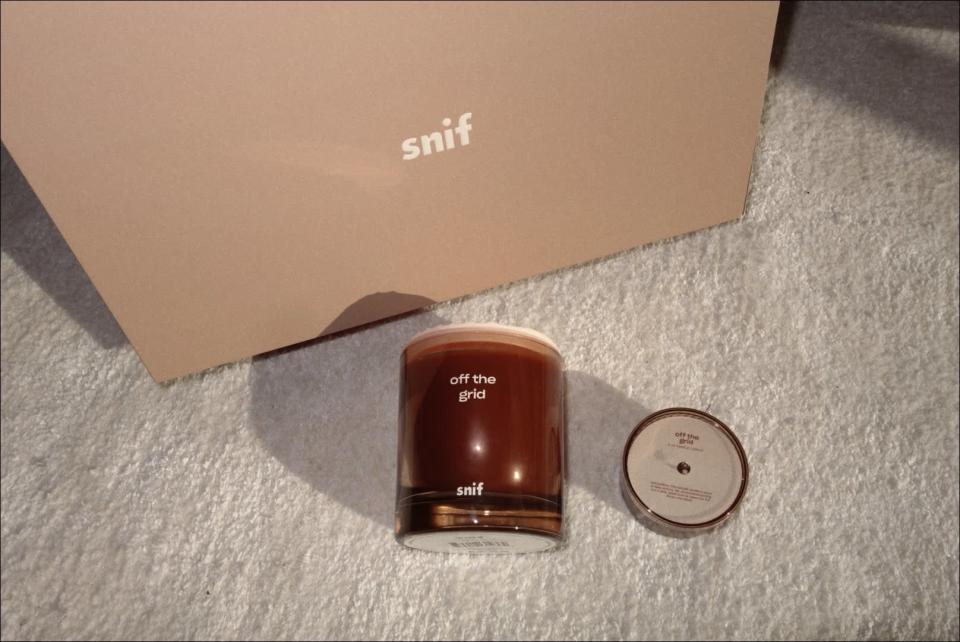 <p>The <span>Off the Grid Candle</span> ($49) was absolutely my favorite of the bunch. I lit it for the first time while I read a book in bed, and I immediately knew it was going to be a keeper. The scent is a mix of lily of the valley, moss, cypress, cedar, tuberose, and sandalwood, and it's unlike anything I've ever smelled. I'm already planning on purchasing a few more of these as gifts, they're that good.</p>