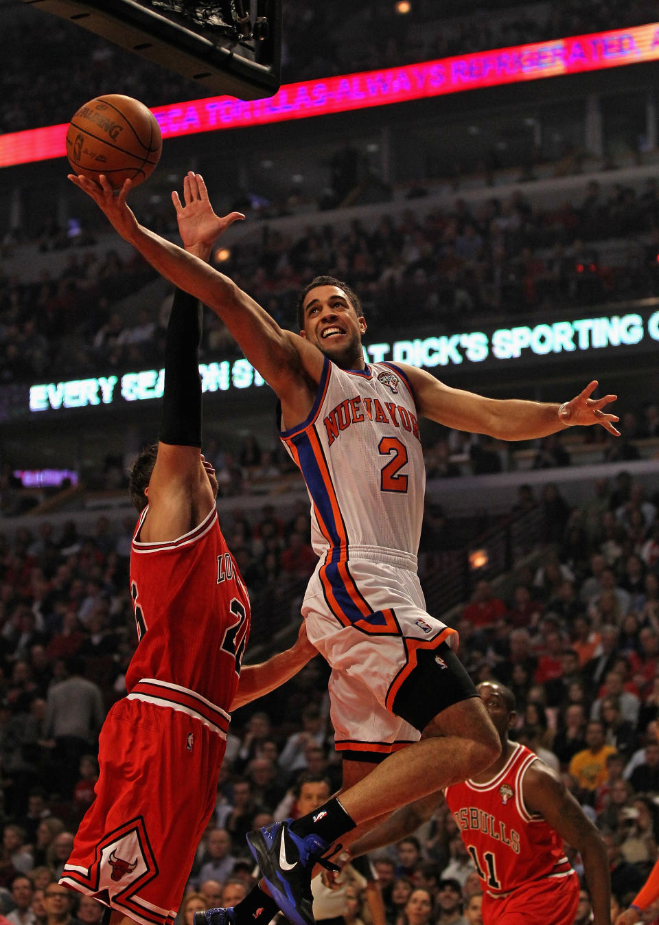 CHICAGO, IL - MARCH 12: Landry Fields #2 of the New York Knicks shoots over Kyle Korver #26 of the Chicago Bulls at the United Center on March 12, 2012 in Chicago, Illinois. NOTE TO USER: User expressly acknowledges and agrees that, by downloading and or using this photograph, User is consenting to the terms and conditions of the Getty Images License Agreement. (Photo by Jonathan Daniel/Getty Images)