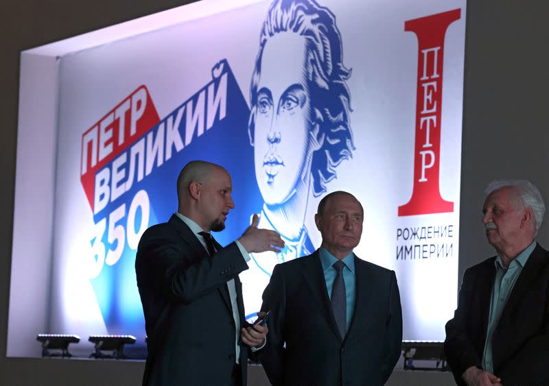 Russian President Vladimir Putin visits an exhibition in Moscow