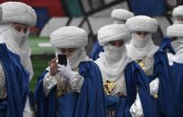 <p>People role-playing as members of the royal entourage await the arrival of the Three Kings before the start of the Epiphany parade in Gijon, Spain, Jan. 5, 2018. (Photo: Eloy Alonso/Reuters) </p>