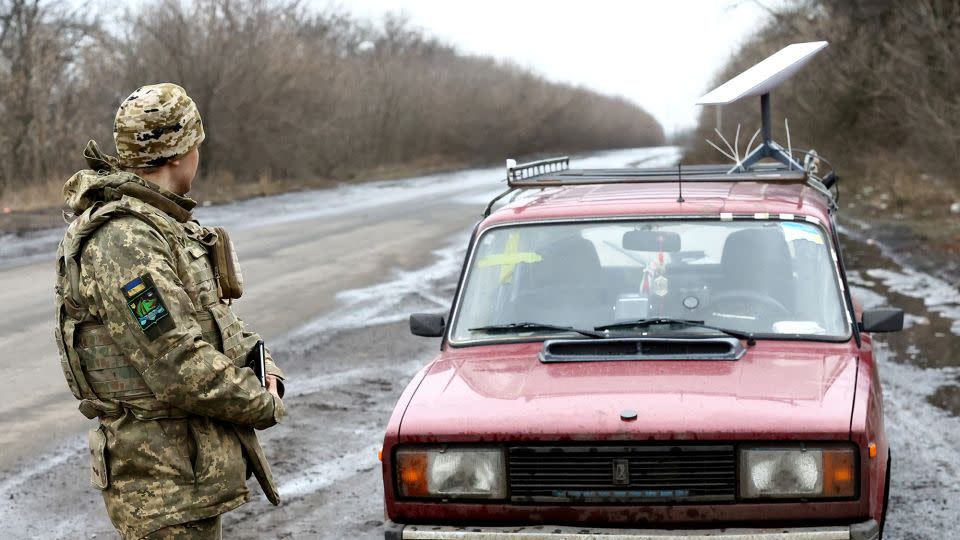 A Ukrainian serviceman stands next to a vehicle that carries a Starlink satellite internet system near the front line in Donetsk region, Ukraine, on February 27, 2023. - Lisi Niesner/Reuters